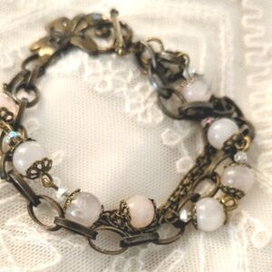 Elegant Multi-Chain Bracelet with Pink and Gold Accents